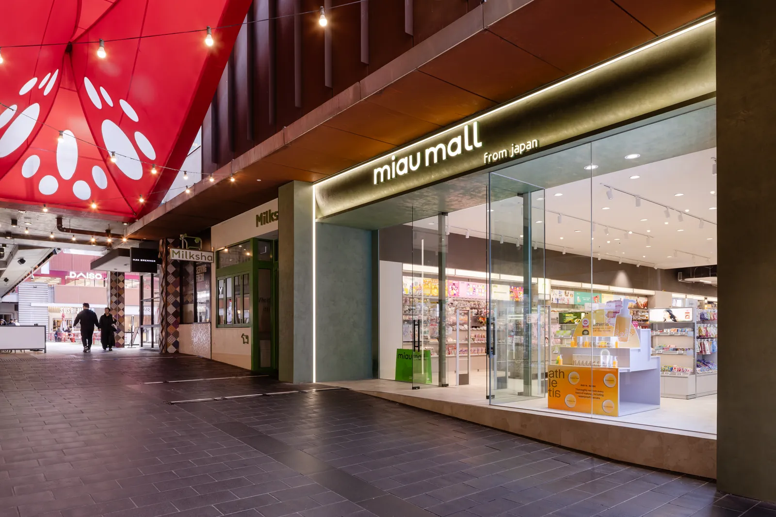 The MiauMall shopfront at QV Melbourne, lit up in the evening